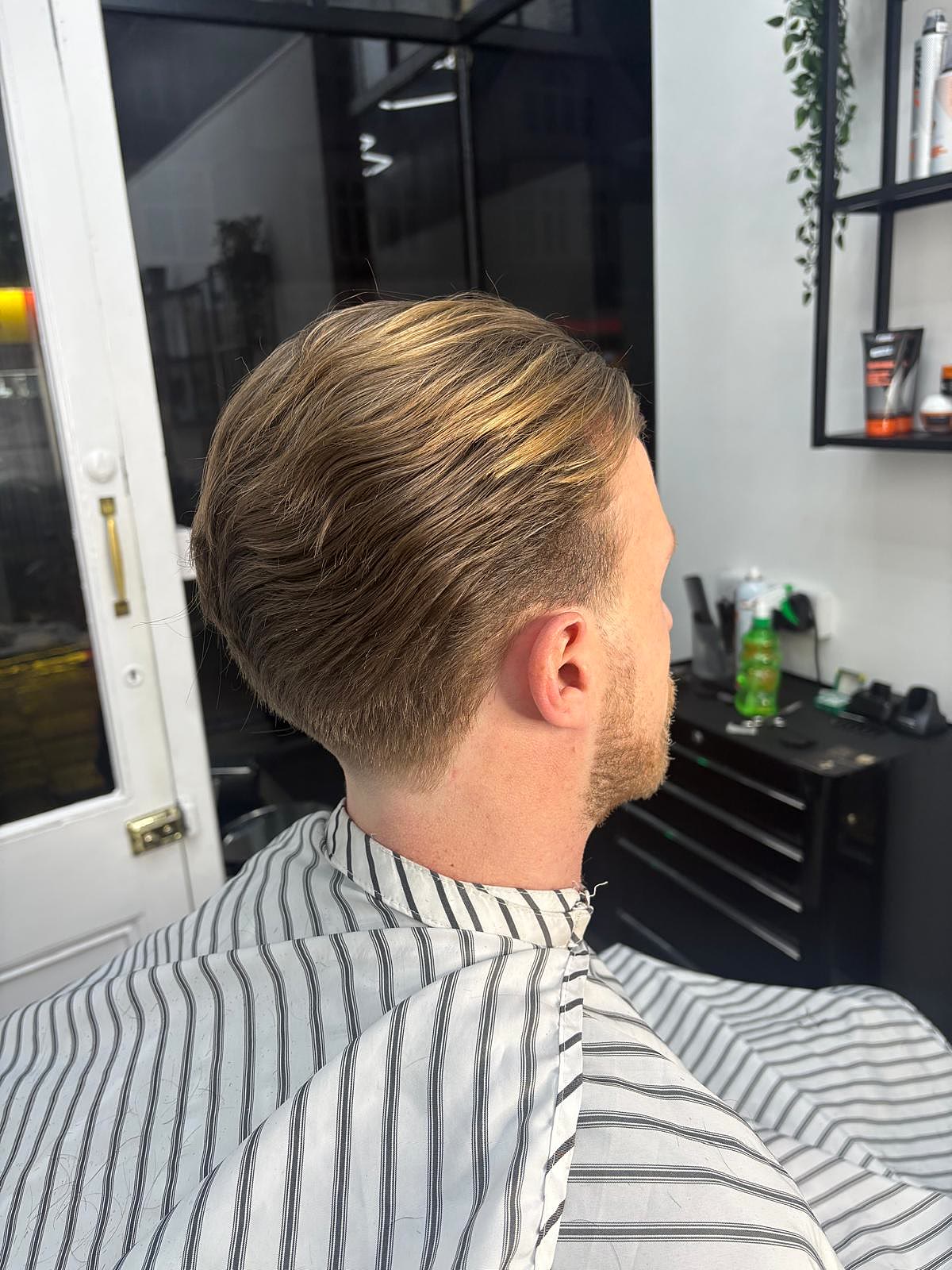 Slicked-back scissor cut fresh from the chair